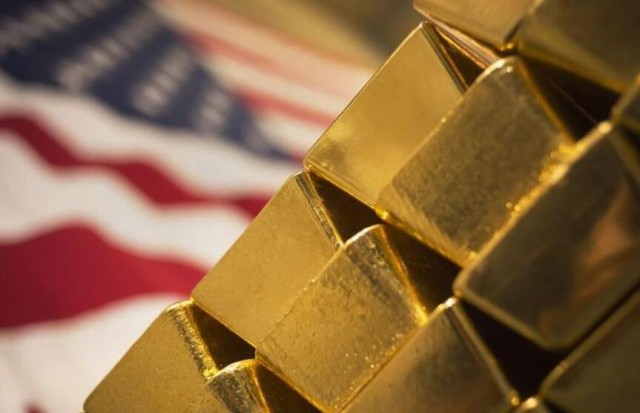Dollar gains cast a shadow on gold prices
