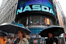 Nasdaq closes near all-time high as major earnings releases