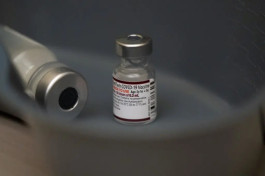 Pfizer lowers its profit forecast as vaccine sales decline