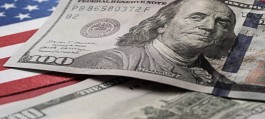 The dollar briefly hit a 7-week high as oil prices fluctuated.