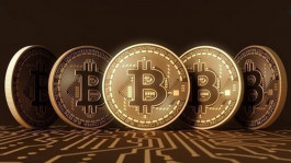 بيتكوين يخترق حاجز 34 ألف دولار